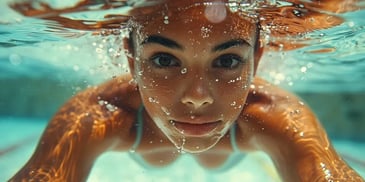 Underwater close-up of a swimmer's face.