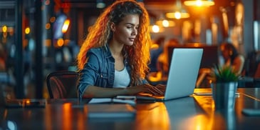 Person typing on a laptop.