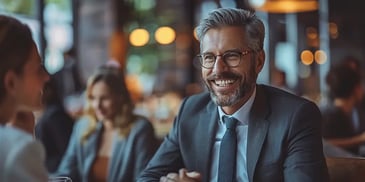 Smiling businessman in a meeting.