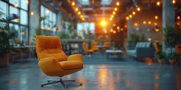 Modern lounge area with a single orange chair on a polished floor.