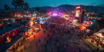 Nighttime festival with vibrant lights and crowds.