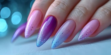 Long nails with pink, purple, and blue gradient.