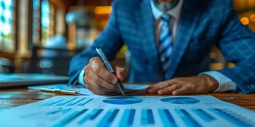 Businessman analyzing charts and graphs.