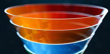 Colorful layered funnel chart on dark background.